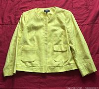 Yellow Mexx blazer, front view showing collarless style and front flap pockets.