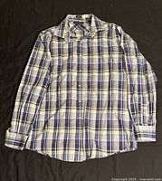 Front view of Tommy Hilfiger slim fit button-up shirt laid flat to display pattern and condition.