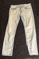 Light blue True Religion jeans, size 36 waist, laid flat showing front side