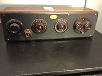 Front view of antique Atwater Kent radio with control knobs and dials visible