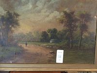 Full front view of the antique landscape oil painting depicting trees, path, person, and building in rural setting