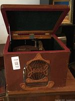 Front view of the Jewel vintage record player with open lid, showing interior turntable and tonearm.