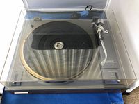 Top view of turntable with clear hinged dust cover closed