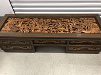 Top-down view showing full carved tabletop panel.