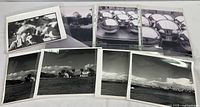 Group photo showing eight 8x10 black and white photos arranged on a surface with protective sleeves, including landscapes, reflective chrome spheres, and more.