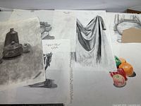 Overall group of 12 sketches on paper with charcoal drawings of still life and fabrics.