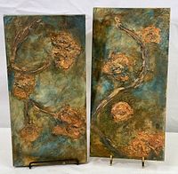 Two vertically oriented paintings side by side on a white background displaying textured floral imagery.