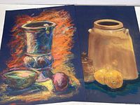 Two original pastel still life artworks side by side on a white surface showing vibrant compositions and color contrasts.