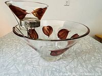 Chip and dip bowl set showing hand-painted brown leaves and gold accents on clear glass.