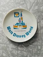 Top view of the vintage ceramic plate with the multicolor Cinderella Castle design and Walt Disney World text.