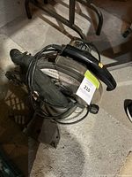 Top angled view of Craftsman circular saw with wrapped power cord, showing blade and handle.