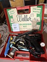 Photo of open red Weller soldering kit case showing kit label and tools inside