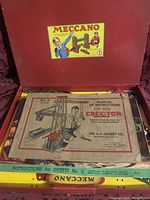 Open box view showing instruction manuals and red interior of box