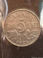 Close-up of 1926 Canadian five cent coin reverse showing 'CANADA', 'FIVE CENTS', '5', maple leaves and date.