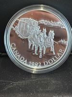 Obverse coin side showing Kingston to York stagecoach design with horse-drawn carriage, text 'CANADA 1992 DOLLAR'