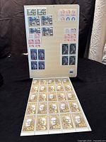 Full view of a mounted album page with multiple blocks of Canadian stamps from the 1960s-70s, and a large sheet of 8-cent stamps at the base.
