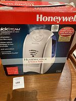 Front view of the Honeywell QuickSteam humidifier box showing product image and branding.
