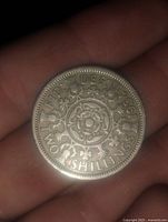 Front side of 1937 English 2 Florin coin showing floral design, inscriptions, and date