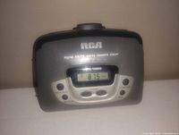 Front view of the RCA vintage digital AM/FM stereo cassette player showing controls and digital tuning display.