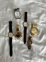 Overall photo of six wrist watches showing various styles and bands