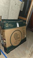 Box of Garden Treasures Living chair showing brand logo and box condition