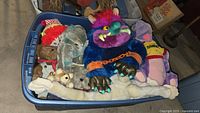 Bin overview showing all plush items including My Pet Monster, Hooter Elephant, teddy bears and Figment