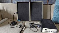 Overall lot showing CPS-128 power source unit, speakers, headphones, and microphone.