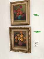 Two framed floral paintings hung on a white wall, each with a tag indicating size 9x7 and a MaxSold label, showing condition and presentation of the lot.