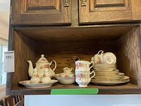 Full set of Paragon China Elizabeth Rose dinnerware and tea service arranged in shelf