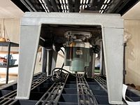 Photo showing underside of the router table and mounted router.