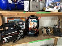 Overall shot of Mastercraft 1/3 sheet sander, Black & Decker Mouse sander, manual sanding blocks and accessories on shelf.