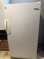 Front view of white upright freezer