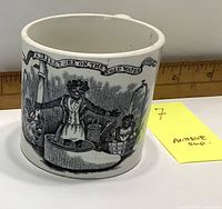 Image of the cup's side showing the full printed scene with bears and a lighthouse, along with the note 'Antique cup'.