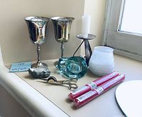 Full view of the lot showing all items arranged on a window sill under natural light