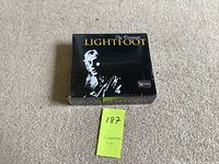Front view of factory sealed black box set titled 'The Original Lightfoot' with white and yellow text and image of Gordon Lightfoot