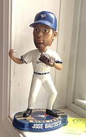 Front view of the bobblehead showing Jose Bautista in Blue Jays uniform poised to pitch, on a blue base with his name.