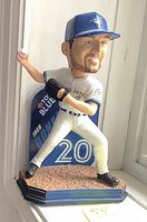 Front view of Josh Donaldson bobblehead in Blue Jays uniform showing detailed face, glove, ball and base.