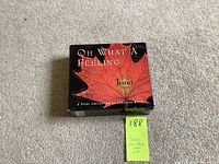 Closed box set of the 4 CDs featuring a red leaf design and Juno branding on a carpeted floor.