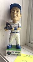 Front view of Pat Borders bobblehead in Blue Jays uniform holding MVP trophy, showing face, uniform details and base text.