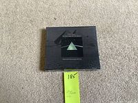 Sealed Pink Floyd The Dark Side of the Moon 20th Anniversary Edition CD showing cover art and shrink wrap intact.