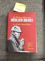 Front cover showing the book title and illustrated Sherlock Holmes in profile holding a pipe.