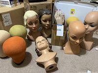 Overview of lot showing foam heads, plastic mannequin busts, ceramic head and box of hands