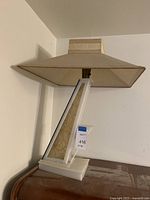 Front and side view of lamp on wooden surface