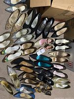 Overview of 28 pairs of women's high heel stiletto shoes, varied colors, patterns, and materials, all used condition packed in boxes.