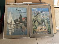Two framed prints from Monet Exhibition, images show Monet-inspired artwork with exhibition details and dates.