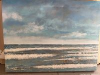 Full view of the ocean scene painting showing the waves and cloudy sky with signature.