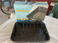 Photo of the Everyday Essentials roasting pan with rack in original box, showing both items clearly on a white table.