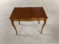 Front angled view capturing table top and leg design