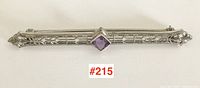 Full view of the 14k white gold bar pin showing the entire length and the central amethyst stone.