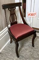 Overall front three-quarter view showing mahogany frame, lyre back, upholstered seat